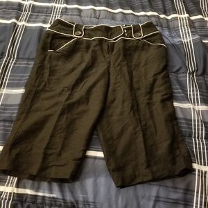 Black long shorts with white trim.